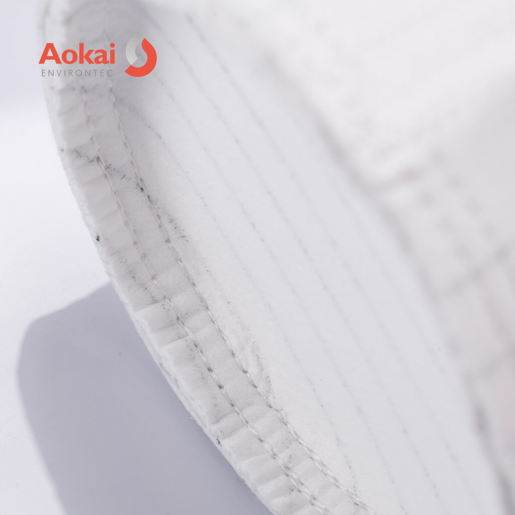 Anti-static filter bag bottom with hemmed